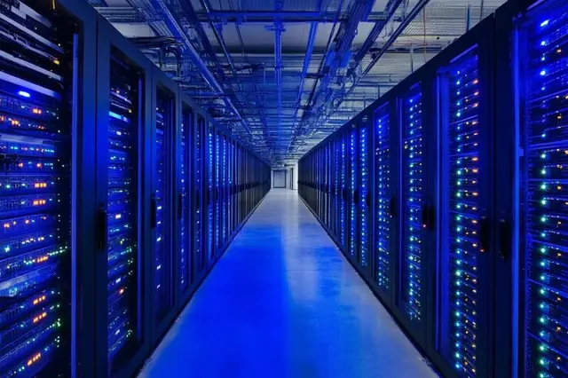Illuminated server rack aisle inside a data centre
